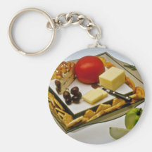 Käse auf Blumen einer Servierplatte Schlüsselanhänger