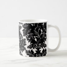 mutiger verwickelter schwarzer Damast auf Weiß Teetasse