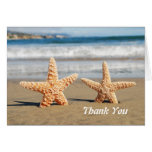 Starfish verbinden auf dem Strand danken Ihnen Kar