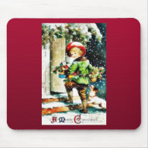 Weihnachtsgruß mit einem Jungen, der an einem hous Mousepad