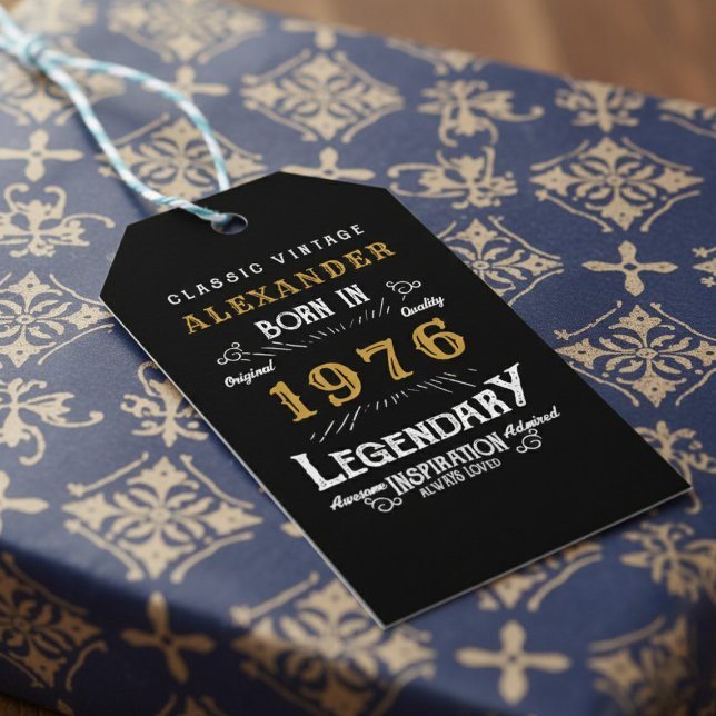 50th Birthday 1976 Add Name Legend Black Gold Geschenkanhänger (Born 1976 birthday gift tag on blue and gold wrapping paper.)