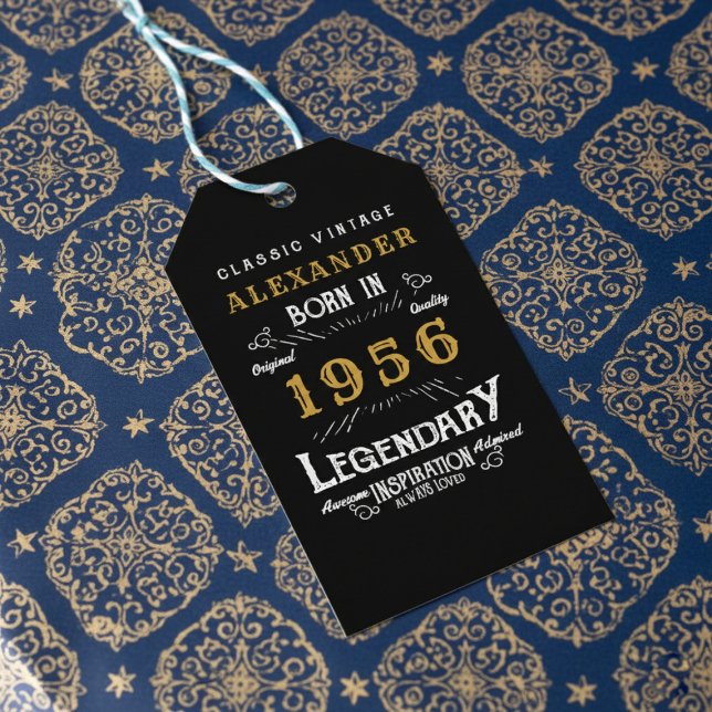 70th Birthday 1956 Add Name Legend Black Gold Geschenkanhänger (Born 1956 gift tag on blue and gold wrapping paper.)