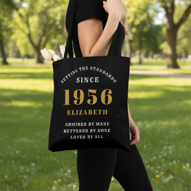 70th Birthday 1956 Black Gold For Her Personalized (Born 1956 birthday tote bag. Background out of focus.)