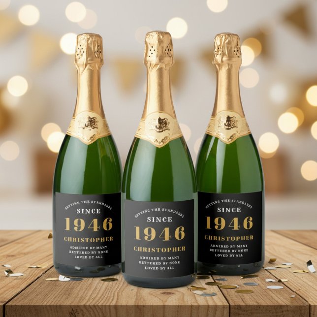 80. Geburtstag Geboren 1946 Name hinzufügen Schwar (Born 1946 sparkling wine bottle label. Background out of focus.)