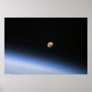 A gibbous moon visible above Earth's atmosphere Poster