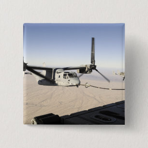 A MV-22 Osprey rebrennt Mittelflug Button