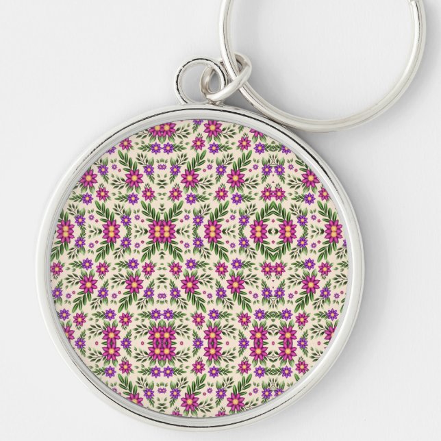 A round keychain features a detailed floral  schlüsselanhänger (Vorne)