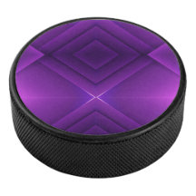 A round purple hockey puck with a geometric