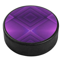 A round purple hockey puck with a geometric