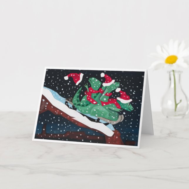 A whimsical holiday card with sledding dinosaurs karte (Kleine Pflanze)