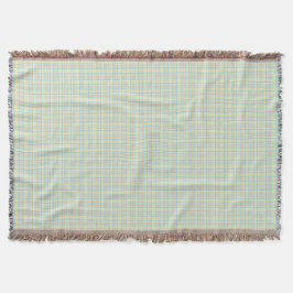 A woven blanket with a subtle green and beigহe  decke