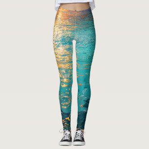 Abstrakte Aqua-Wellen mit goldenem Sonnenlicht Leggings