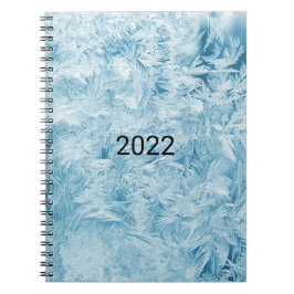 abstrakte blaue Federn und Schneeflocken Notizblock