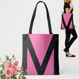Abstrakte geometrische Form in Schwarz und Neonpin
