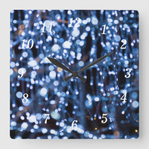 Abstrakte Uhr der blauen Leuchtenhalterung