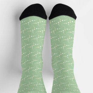 Abstraktes gepunktetes Muster auf hellgrünem Hinte Socken