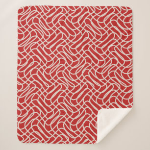 Abstraktes Muster in Rot und Creme Sherpadecke