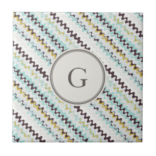 Abstraktes Mustermonogramm des niedlichen bunten Fliese