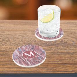 Abstraktes Rotmineralmuster mit anfänglichem Getränkeuntersetzer