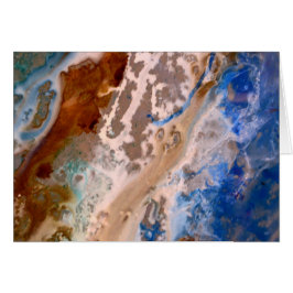 Abstraktes Sandstrandmuster mit Schaumwasser