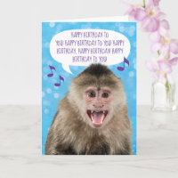 Affe singt glücklich zum Geburtstag und wascht die