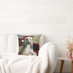 Afghanischer Hund, der einen Weihnachtshut trägt Kissen