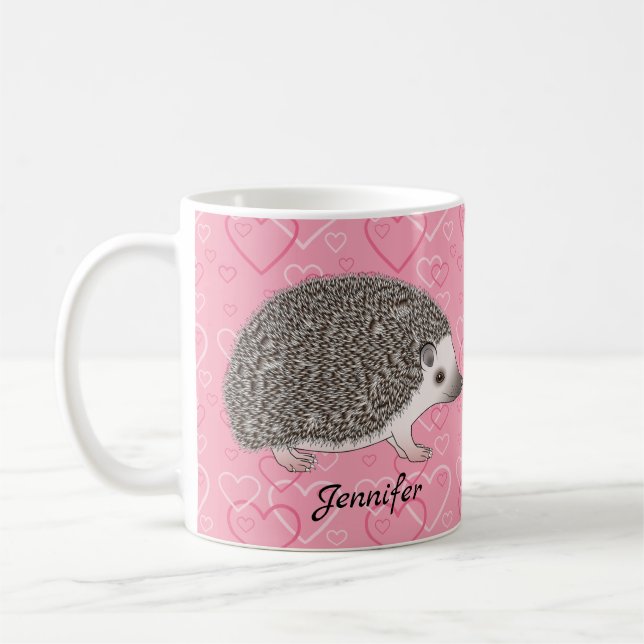Afrikanischer Pygmäen-Igel auf rosa Herzmuster Kaffeetasse (Links)