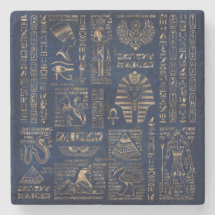 Ägyptische Hieroglyphen und Gottheitgold auf Steinuntersetzer