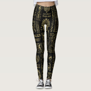 Ägyptische Hieroglyphen und Gottheitsgold auf Leggings
