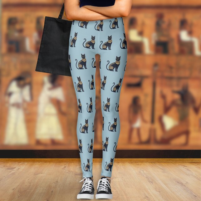 Ägyptische Schwarze Katze Gemustert Dusty Blue Leggings (A pair of light blue leggings with a pattern of Egyptian-style black and faux gold cats)