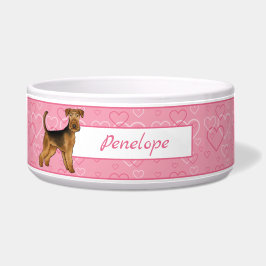 Airedale Terrier Hund mit rosa Herzen und Haustier Napf