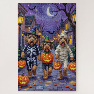 Airedale Terrier Hunde beim Trick-or-Treat an Hall Puzzle