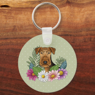 Airedale Terrier mit farbenfrohen Blumen und Namen Schlüsselanhänger