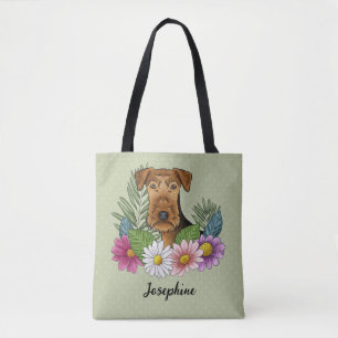 Airedale Terrier und farbenfrohe Sommerblumen Grün