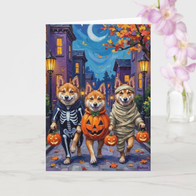 Akita Dogs Trick-or-Treating in Halloween-Kostümen Karte (Orchidee)