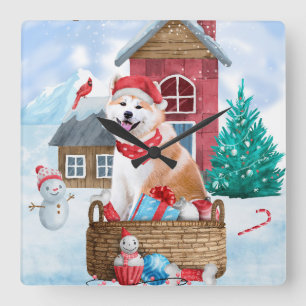 Akita-Hund im Schneeschnee-Weihnachtshaus Quadratische Wanduhr