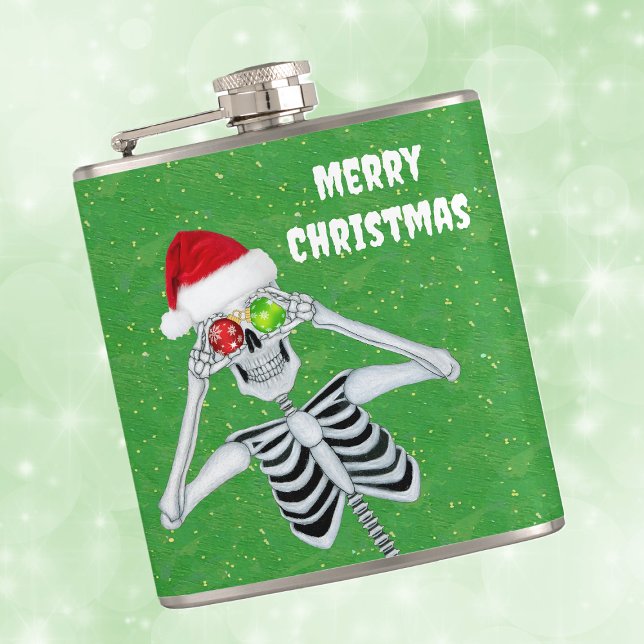 Albernes Weihnachtsgeschmack Eyes Green Gold Flachmann (Silly Merry Christmas skeleton ornament eyes Santa hat on green with gold flecks hip drinking flask.)
