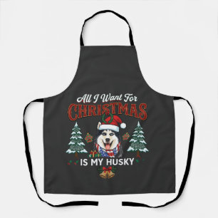 Alles was Weihnachten will ist Husky-Hund im Weihn Schürze