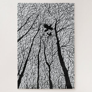 Als Silhouette erscheinende Raben in den Winterbäu Puzzle