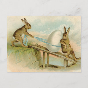 Alte antike Vintage glückliche Osternkaninchen und Feiertagspostkarte