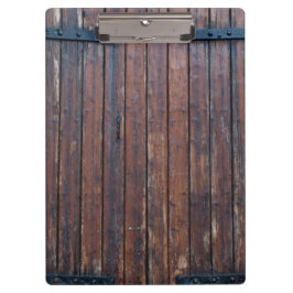 Alte braune Holztüren mit schwarzem Eisen unterstü Klemmbrett