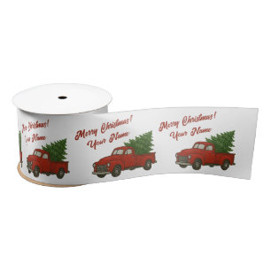 Alte rote Vintage-Pickup-Truck mit Weihnachtsbaum Satinband