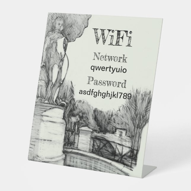 Alter Brunnen im Park mit Skulpturenjunge Sockelschild (Vorderseite)