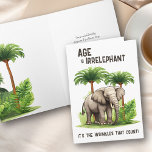 Alter ist irrelephäre Falten Elephant Funny Geburt Karte<br><div class="desc">Die sonnige Geburtstagskarte mit dem Buchstaben "Alter ist irrelevant .. es sind die Falten, die zählen!". Das Design besticht durch einen hübschen Elefanten, der mit tropischen Palmen und Dschungelgrün gerahmt ist. Sie können den Geburtstagsgruß im Inneren personalisieren und auch die Möglichkeit haben, ein Schild mit Ihrem Namen(en) hinzuzufügen, wenn Sie...</div>