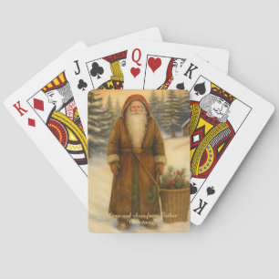 Althergebrachter Weihnachtsmann spielt Spielkarten