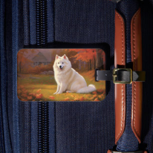 Amerikanischer Eskimo Hund in Herbstlaub-Farben In Gepäckanhänger