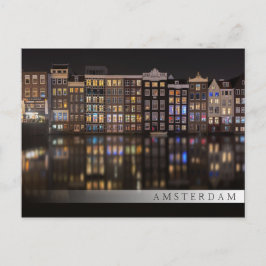 Amsterdam-Häuser mit bunten Lichtern in der Nacht Postkarte