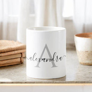 Anfängliches Monogramm mit weißem schwarzem Namen Kaffeetasse