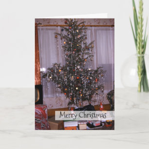 Antiker Weihnachtskiefer mit Tannenbaumschmuck und Feiertagskarte