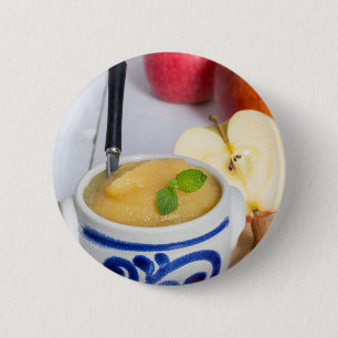 Applesauce with cinnamon in stoneware bowl button